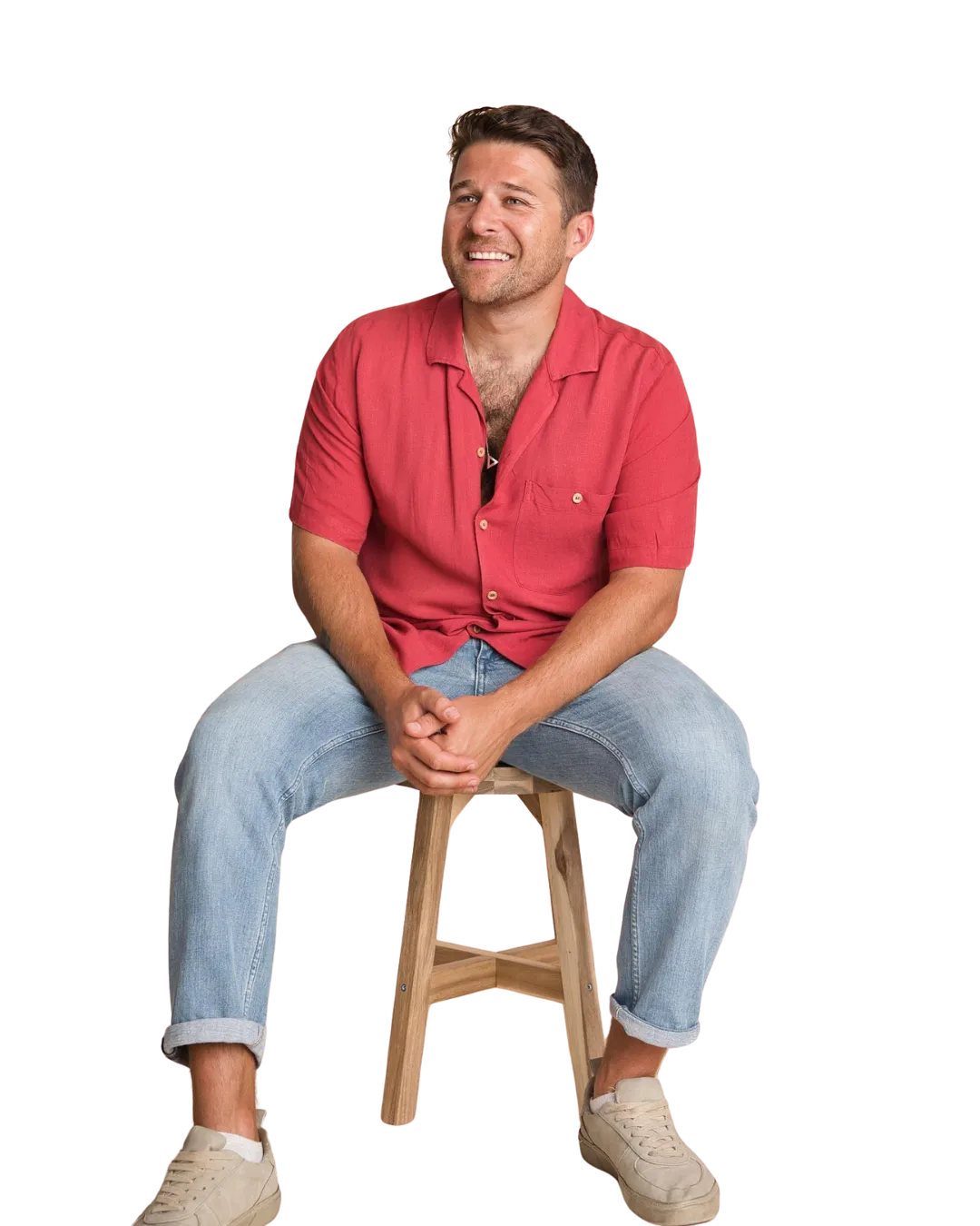 Maxee, wedding and event DJ, sitting on a stool